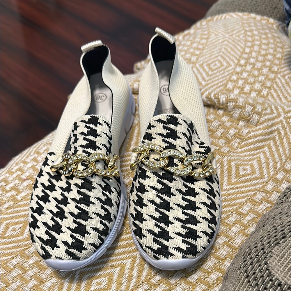 Chic Black and Cream Loafers with Gold Chain